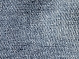 A close-up of various denim fabric swatches.