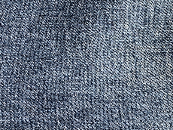 A close-up of various denim fabric swatches.