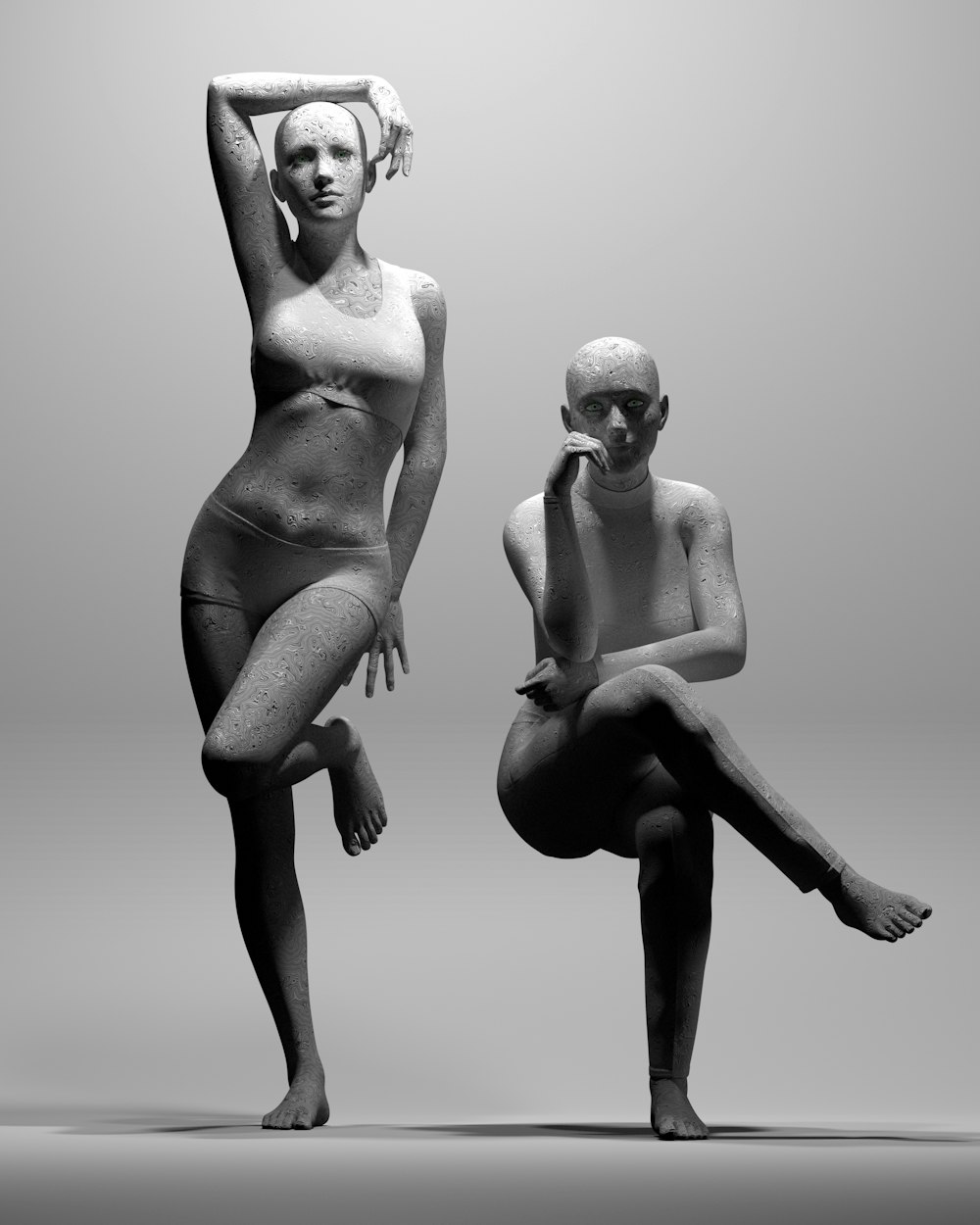 a black and white photo of two naked women