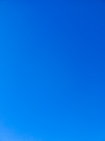 a group of people standing on top of a snow covered slope