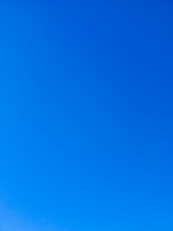 a group of people standing on top of a snow covered slope