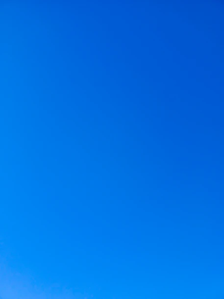 a group of people standing on top of a snow covered slope