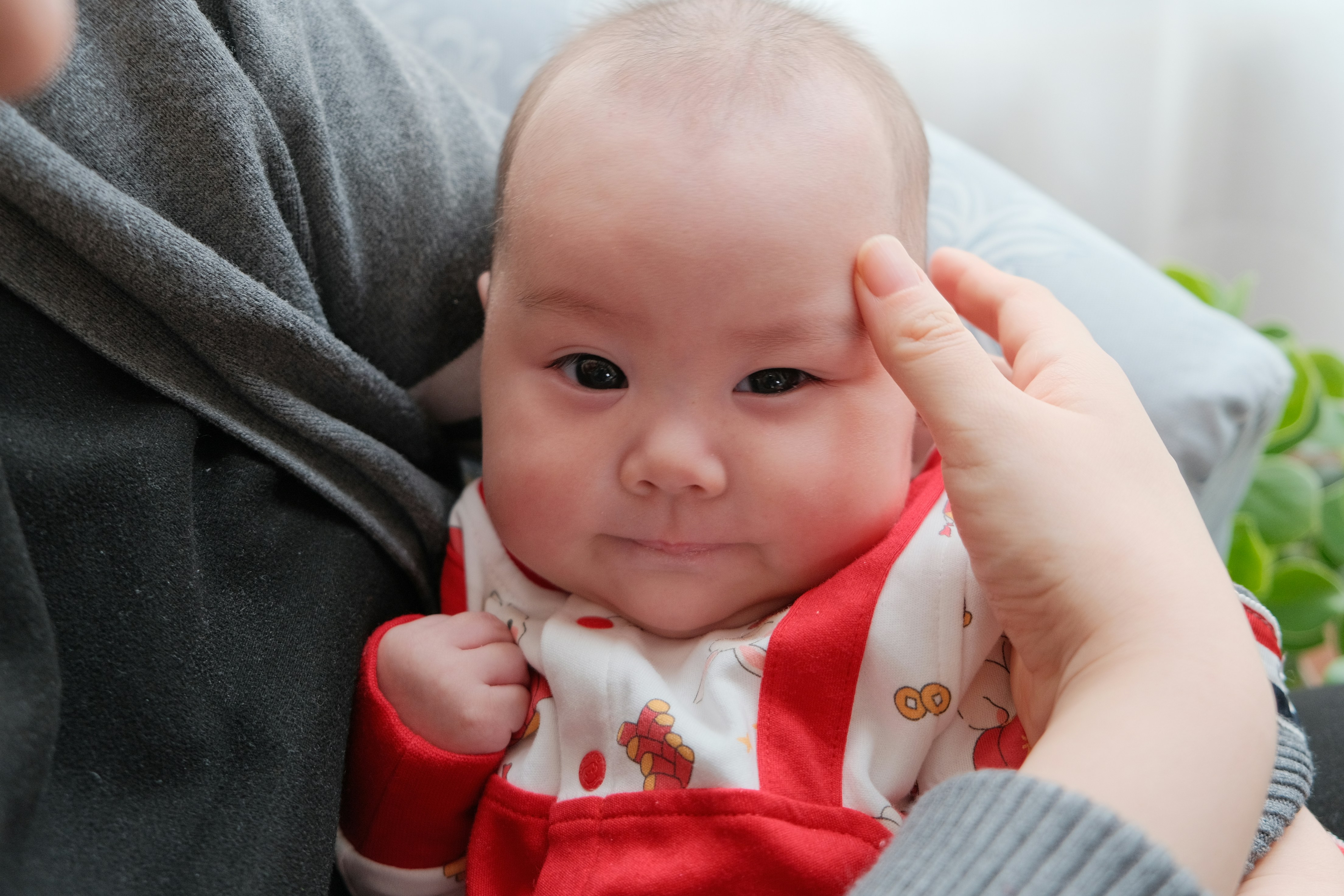 a woman holding a baby in her arms