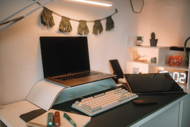 A cozy indoor scene showcasing a variety of tech gadgets and accessories neatly organized on a desk with warm lighting.