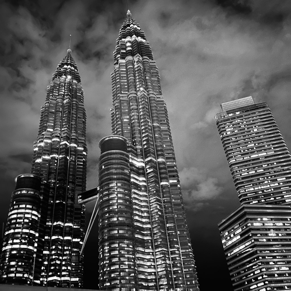 a black and white photo of some very tall buildings