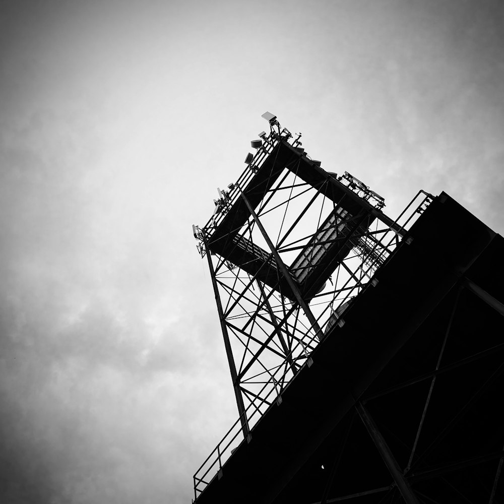 a black and white photo of the top of a tower