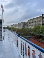 A neat balcony floor being wiped down by a trained staff member.