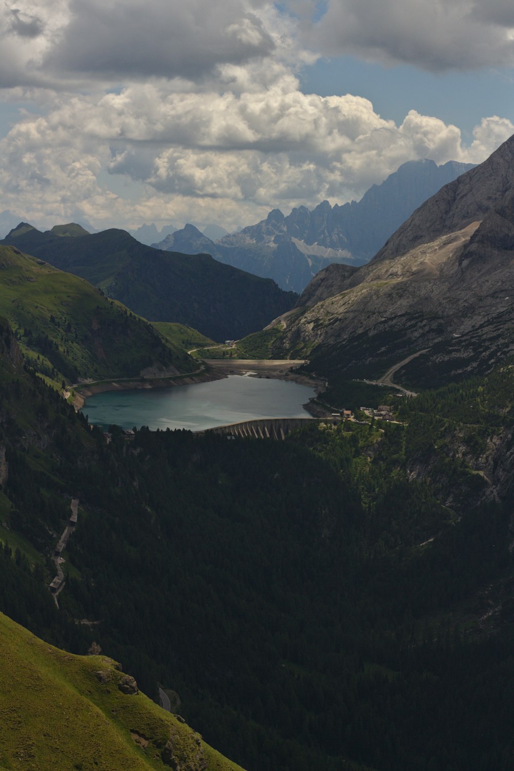 a view of a lake in the middle of a mountain range