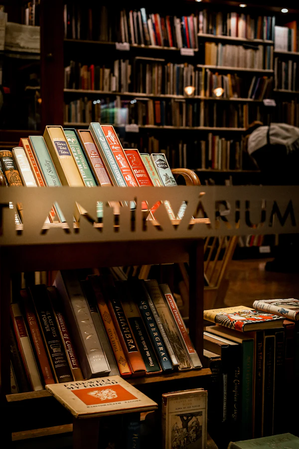 An aged bookshelf filled with old leather-bound books in a warm vintage library, lit by a reading lamp