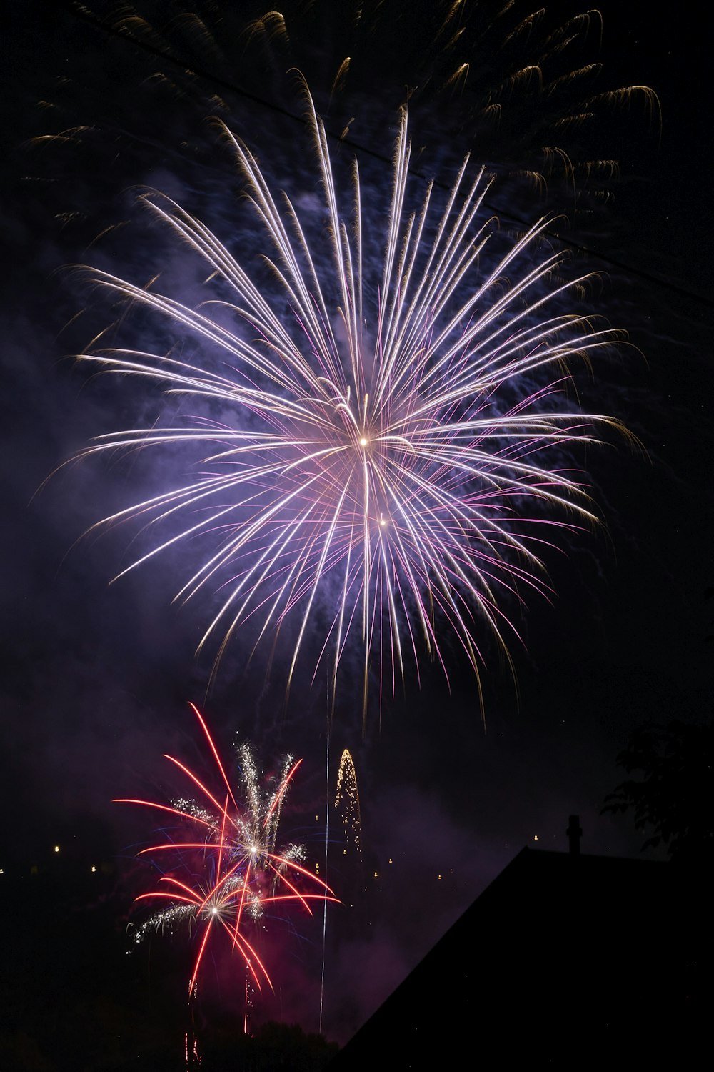 a colorful fireworks display in the night sky