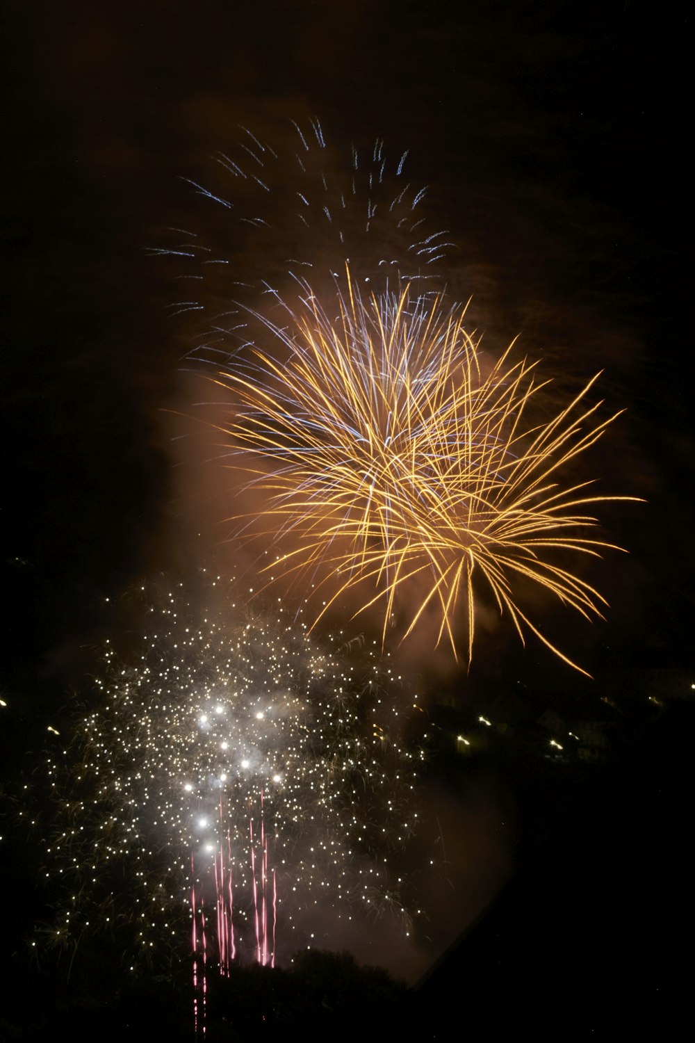 a bunch of fireworks are lit up in the night sky