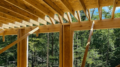 a view of a wooden roof in the woods