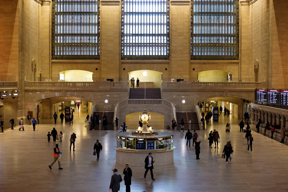 a group of people standing in a large building