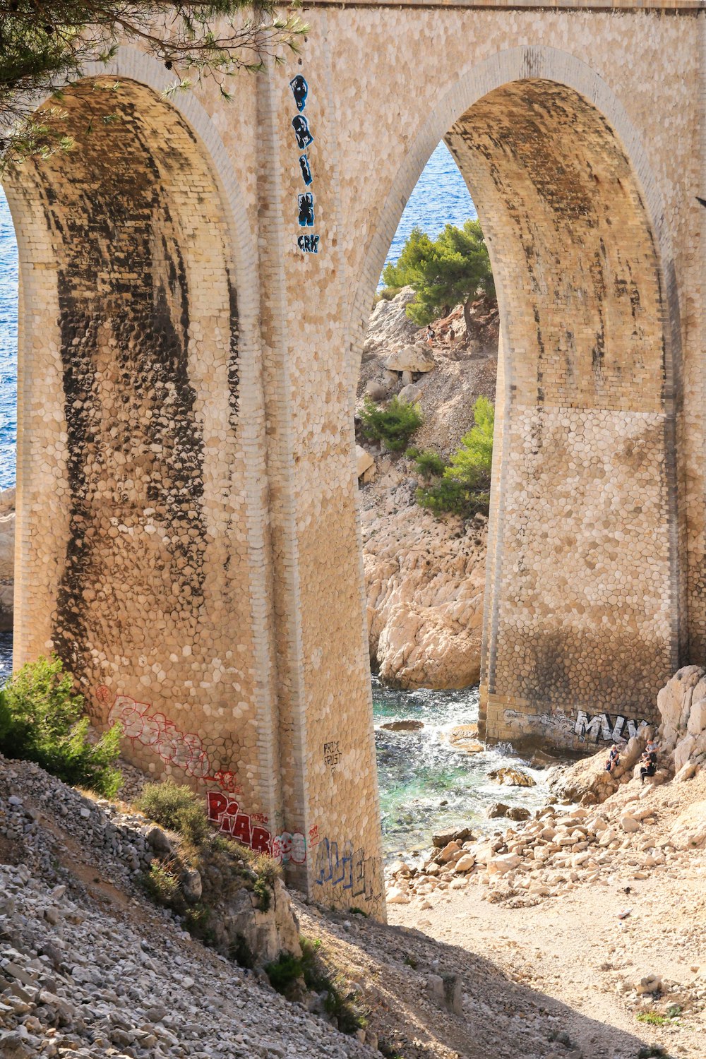 a large stone bridge over a body of water