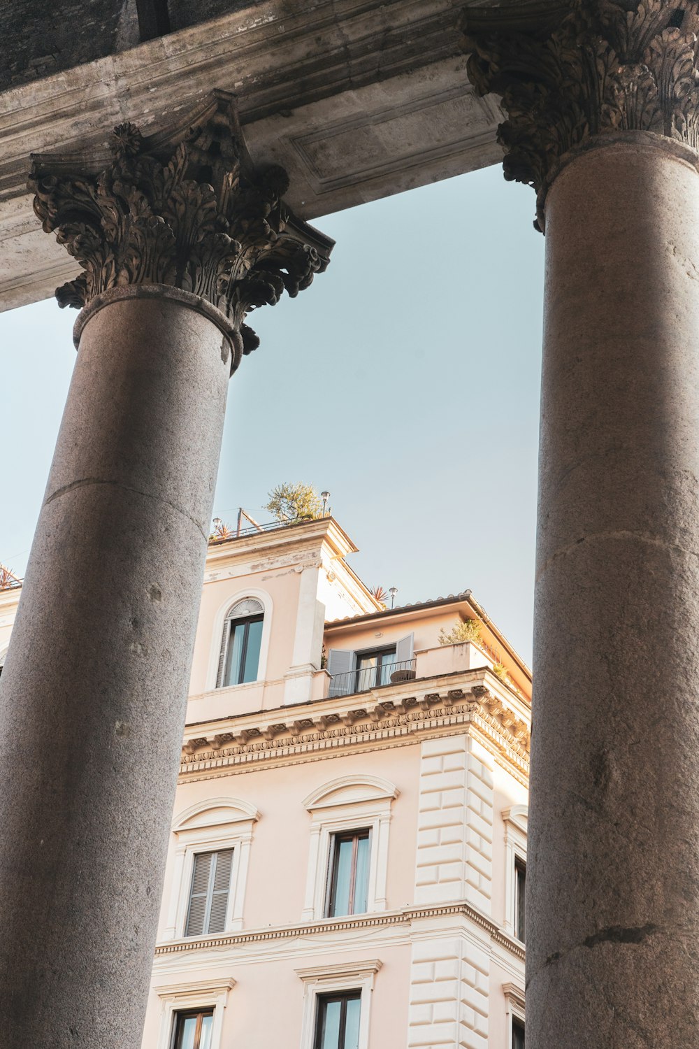 a couple of large pillars in front of a building