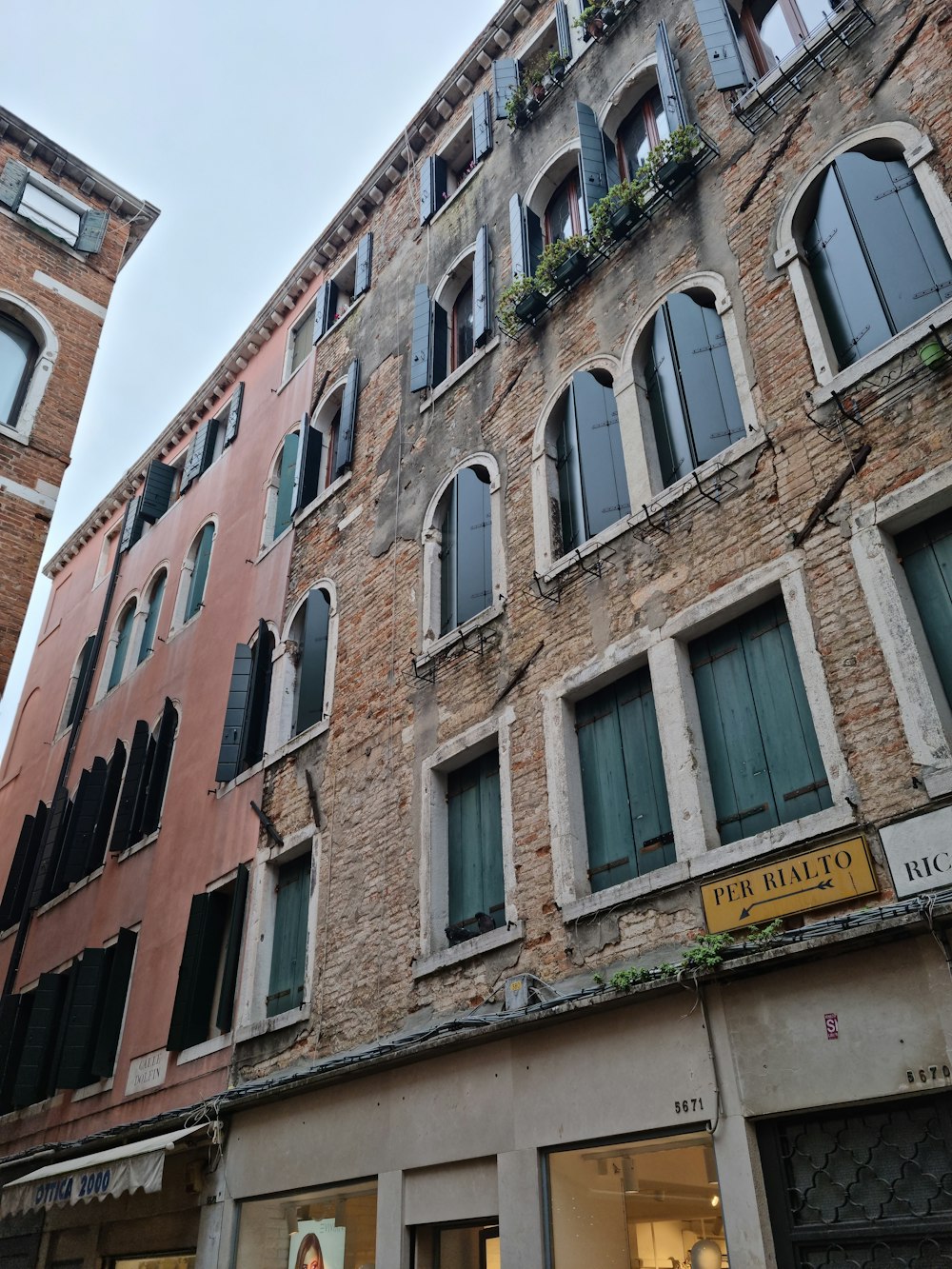 a tall brick building with lots of windows