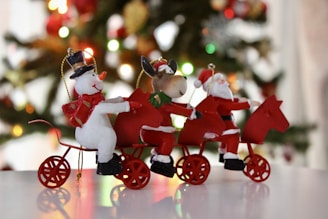 A joyful group of riders preparing their bikes adorned with festive Christmas decorations.