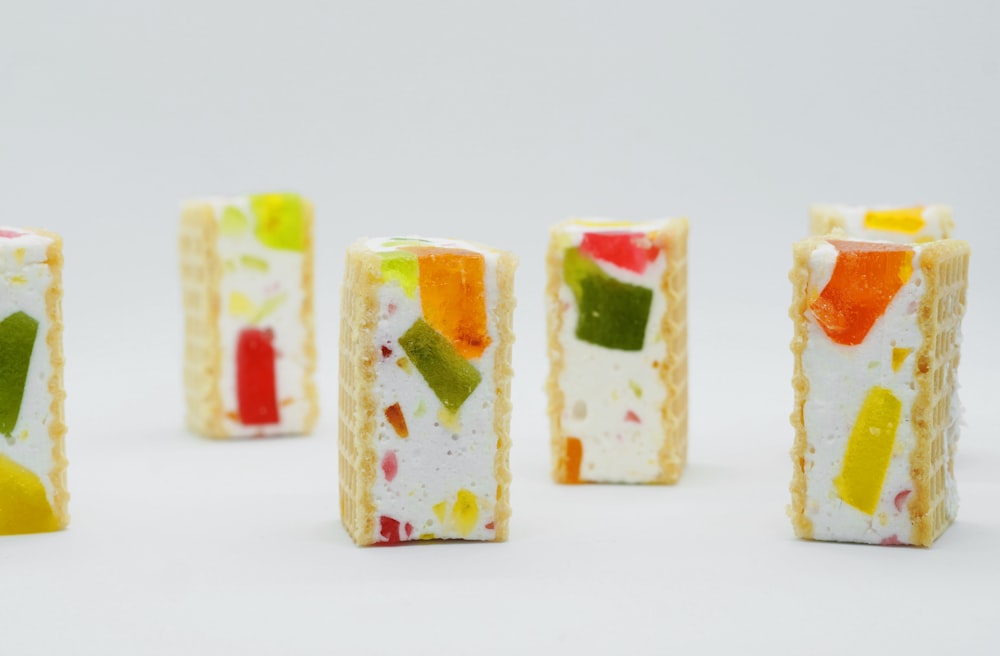 a group of small pieces of food sitting on top of a table