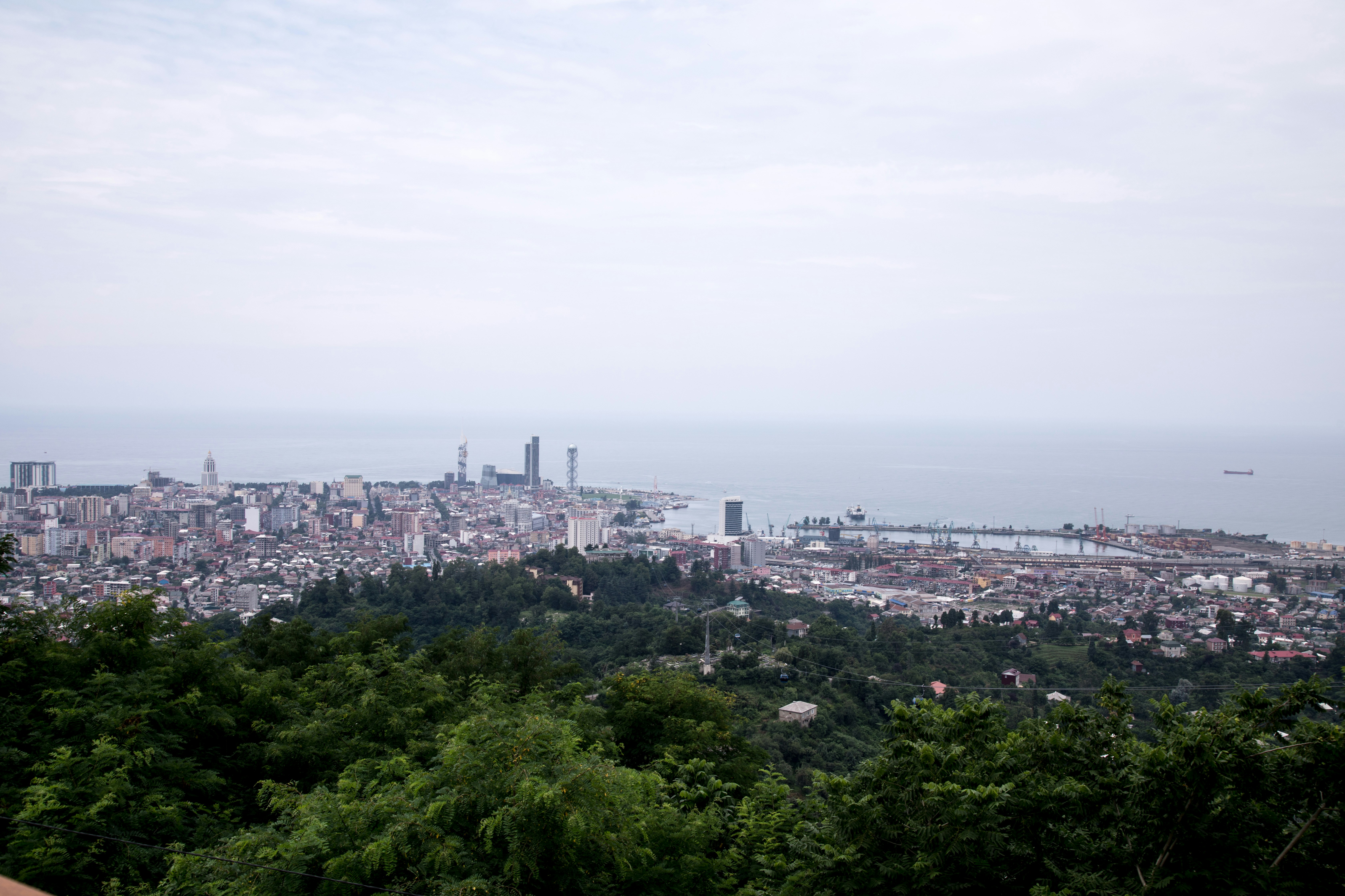 a view of a city from the top of a hill