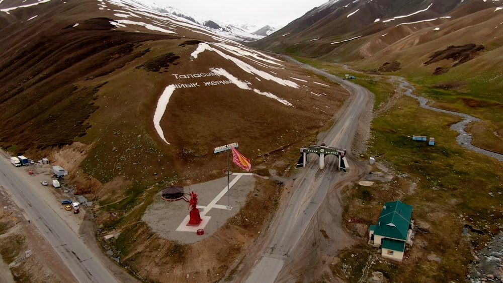 an aerial view of a road in the mountains