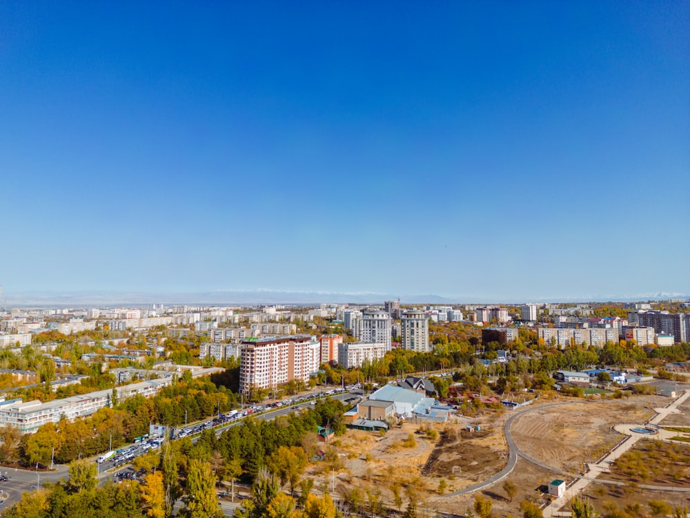 an aerial view of a city with lots of trees