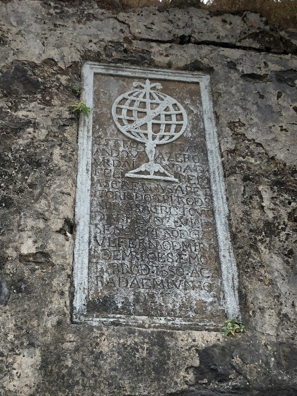 a stone wall with a plaque on it