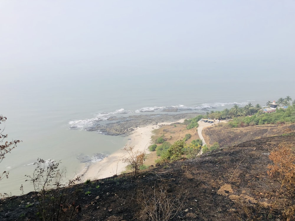 a view of a beach from a hill