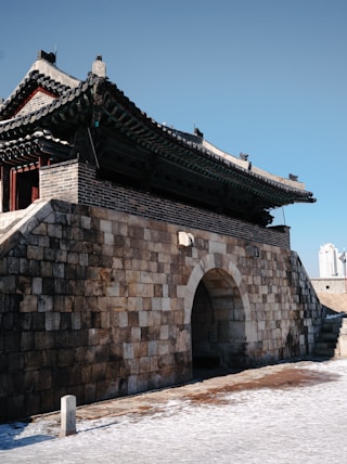 a stone building with stairs leading up to it