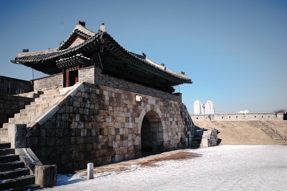 a stone building with stairs leading up to it