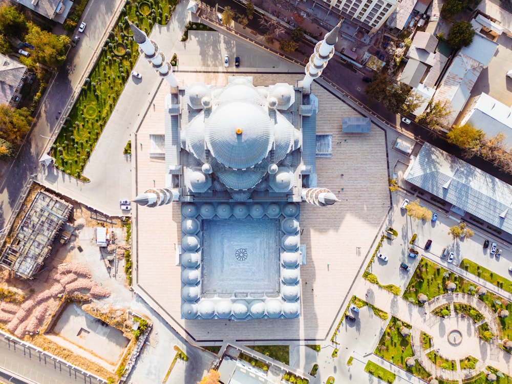 an aerial view of a large white building