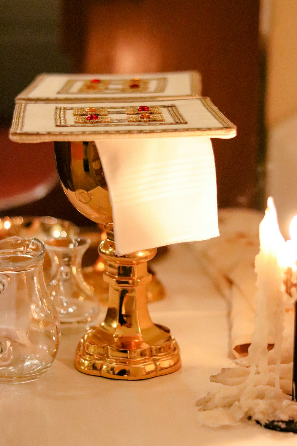 a table topped with candles and a paper towel
