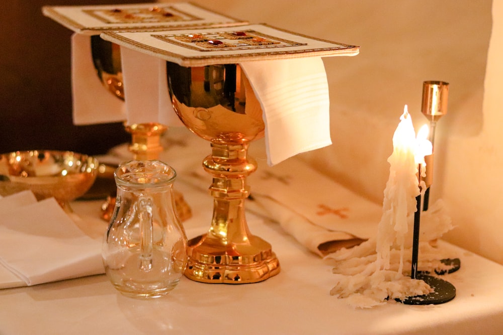 a table topped with candles and other items