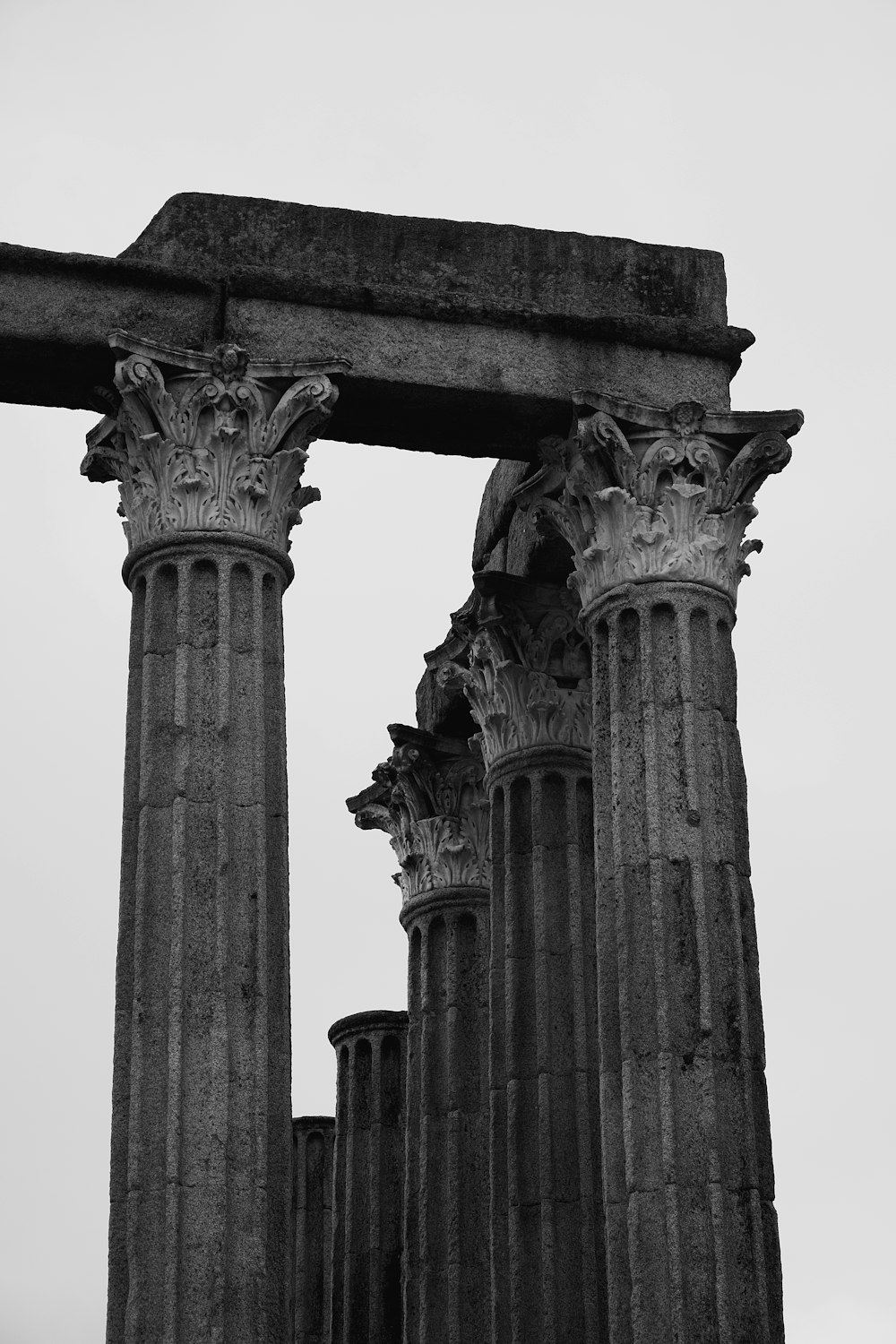 a black and white photo of two columns