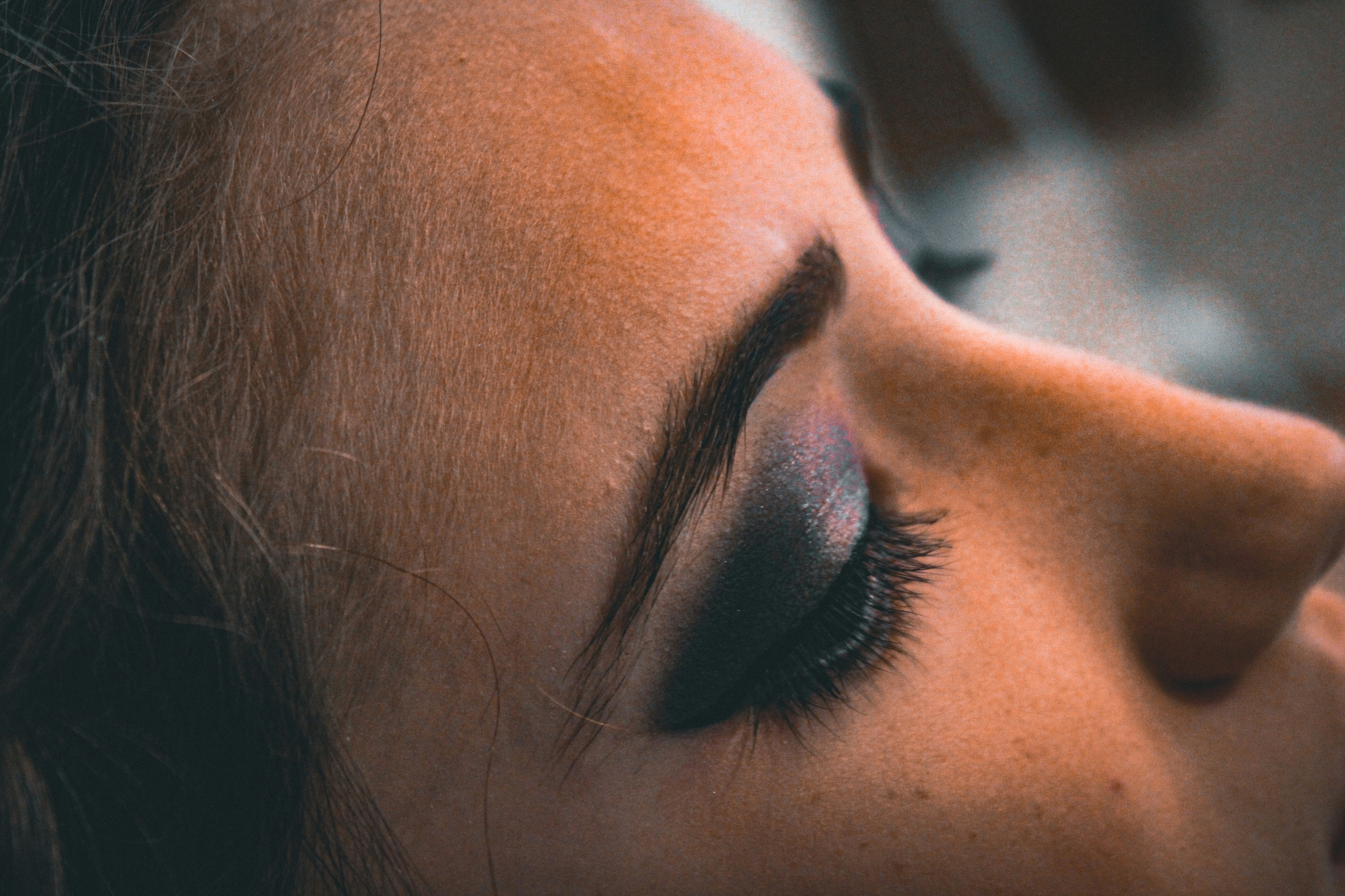 Close up of dramatic smoky eye makeup with long lashes