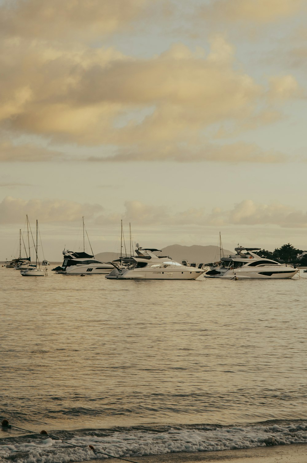 a group of boats floating on top of a body of water