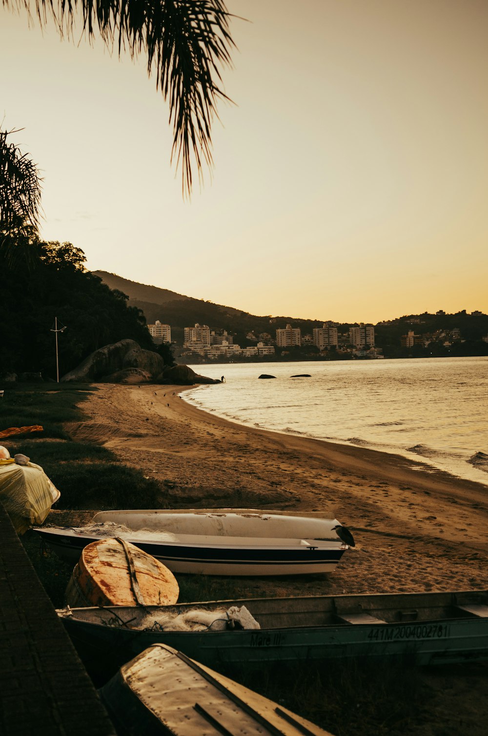 a couple of boats sitting on top of a beach