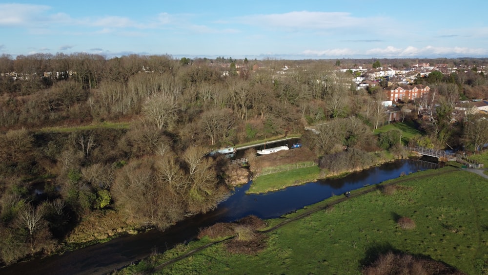 a river running through a lush green countryside