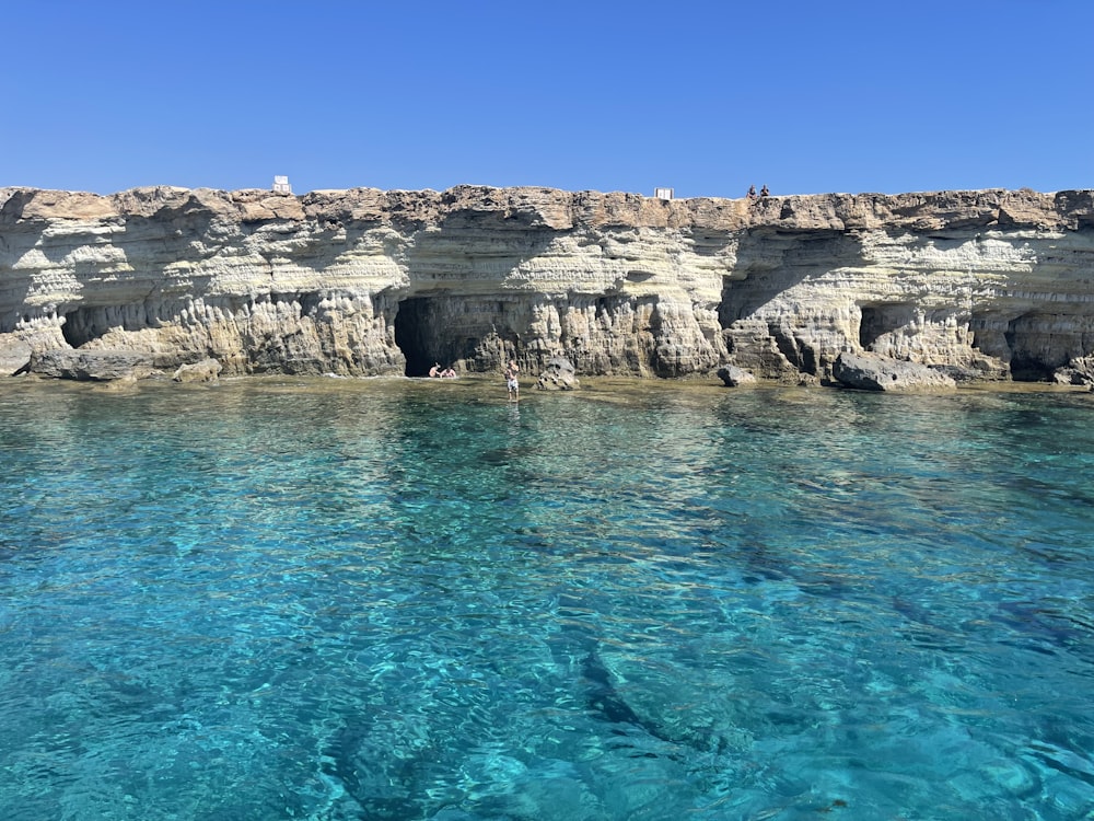 a body of water that has some rocks in it