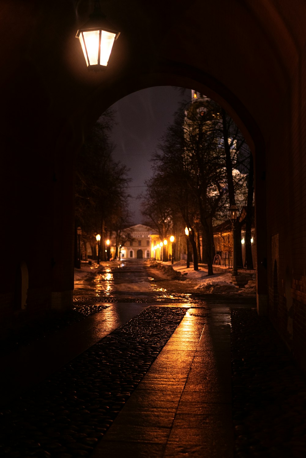 a city street at night with a light on