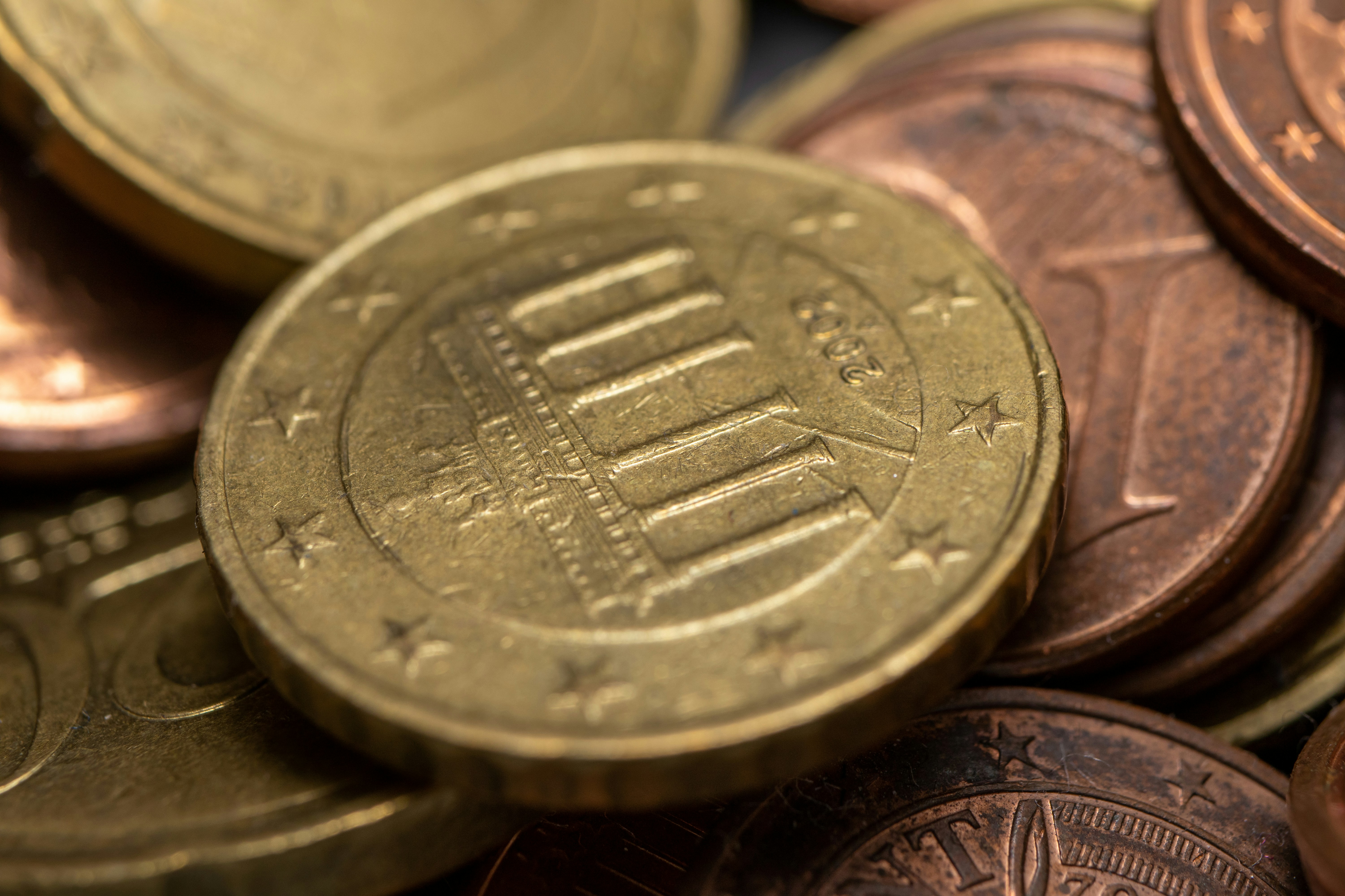 a close up of a pile of coins