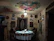 A warm, rustic dining table set with traditional Colombian dishes and vintage decor in the background.