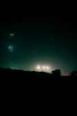 Dark, misty urban landscape with subtle light flares reflecting the hardwave vibe.