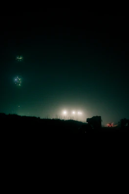 Dark, misty urban landscape with subtle light flares reflecting the hardwave vibe.