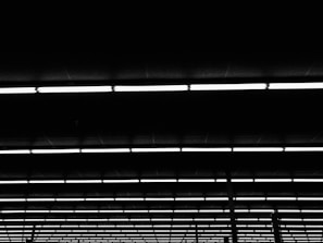 Rows of LED luminaires and traffic signal components neatly arranged in a workshop