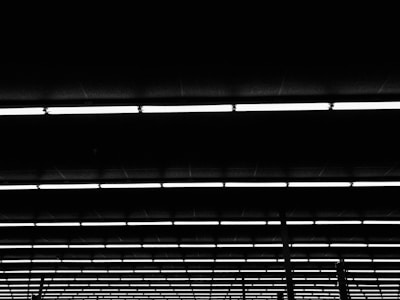 Rows of LED luminarias neatly arranged in a workshop ready for installation