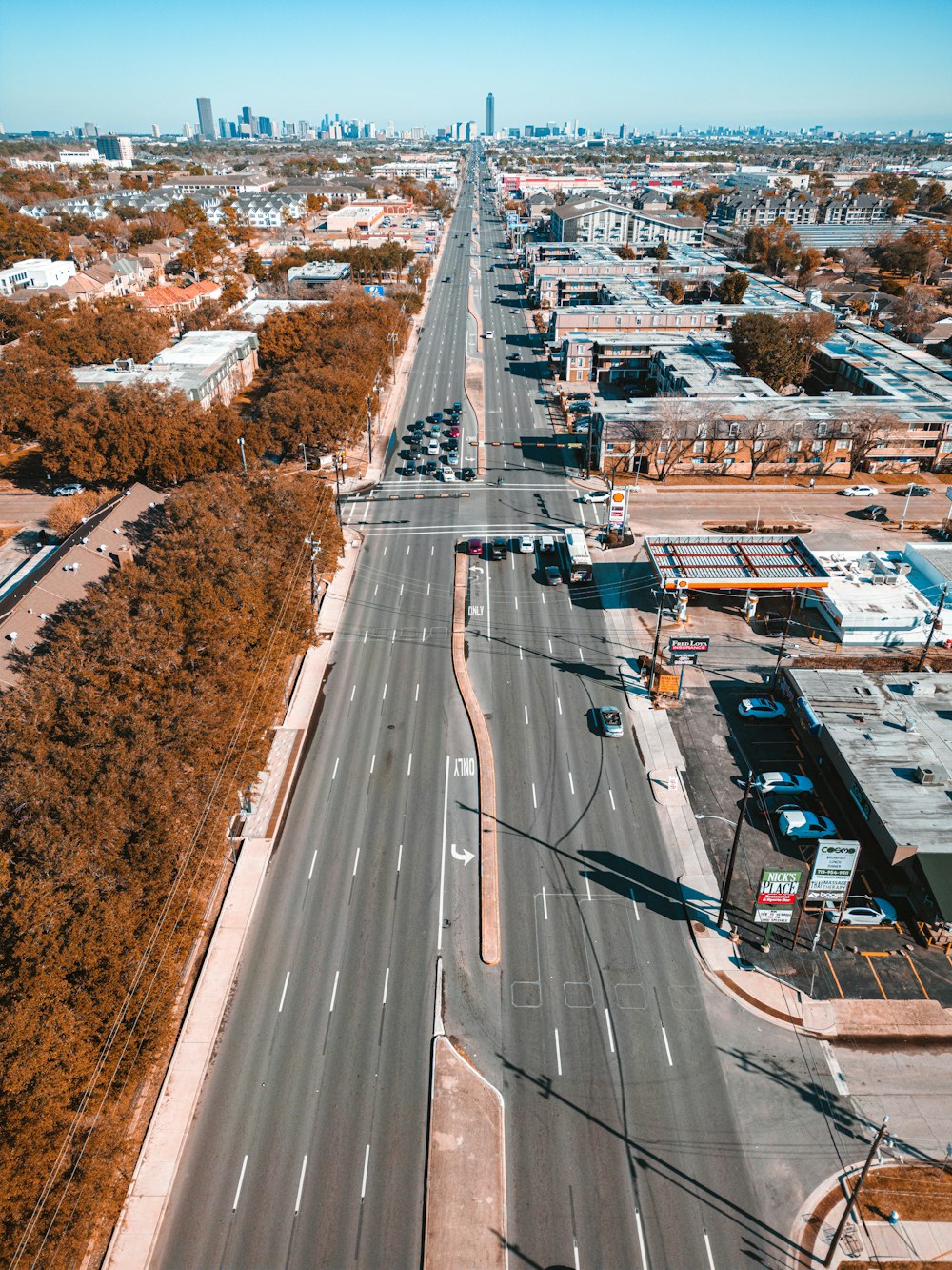 an aerial view of an empty highway in a city