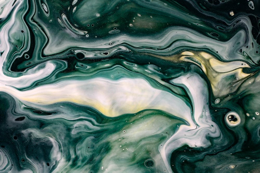 an abstract painting with green and white colors