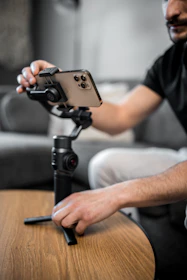 Behind-the-scenes shot of a content creator setting up a smartphone for Instagram Reels filming.