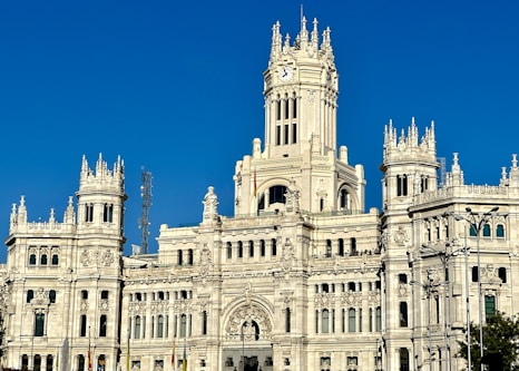 a large white building with a clock tower