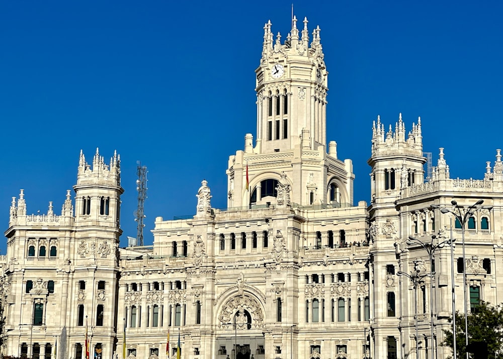 a large white building with a clock tower